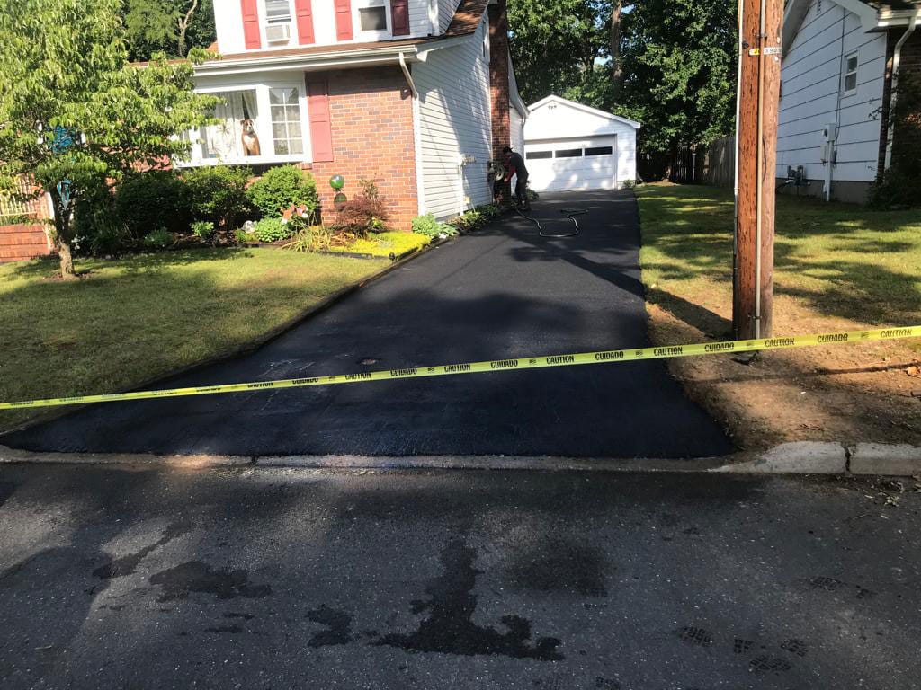 Freshly paved black asphalt driveway