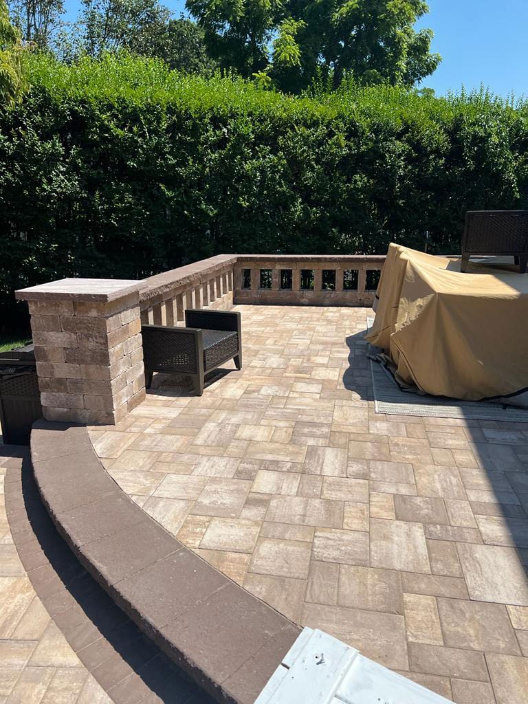 Paver patio with a masonry seating wall