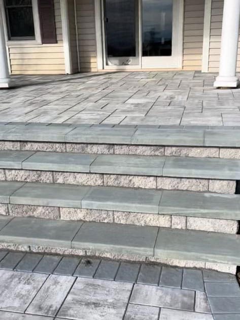 Wide paver steps with stone risers