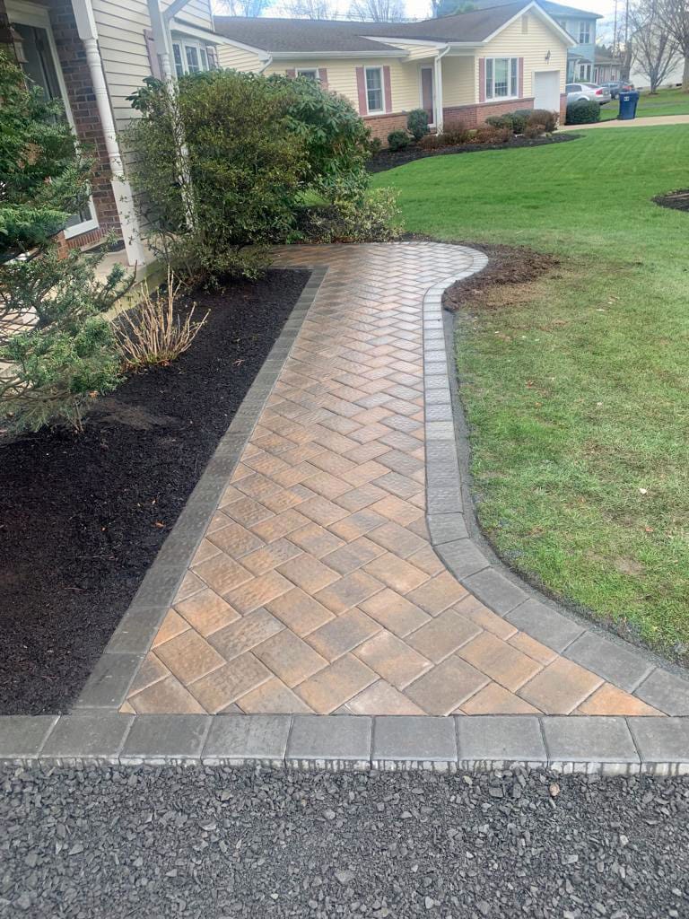 Curved paver walkway with a border